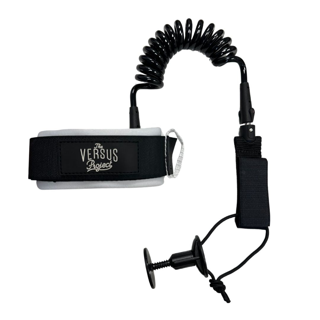 A black neoprene padded strap bicep leash with a heavy duty 7mm thick coil and double marine-grade stainless steel swivels, featuring a grey cuff and an easy top access plug.